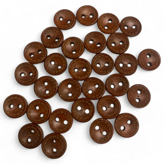 Pile of brown two-hole buttons.