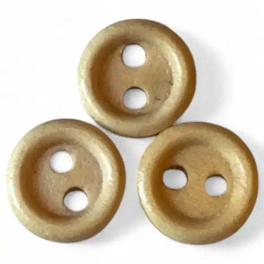 Three tan two-hole buttons.