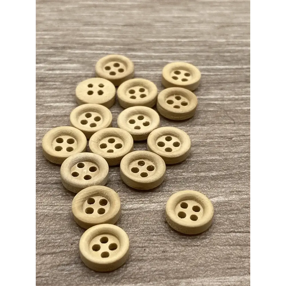 Pile of four-hole wooden buttons.