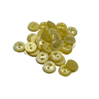 Pile of yellow sewing buttons.