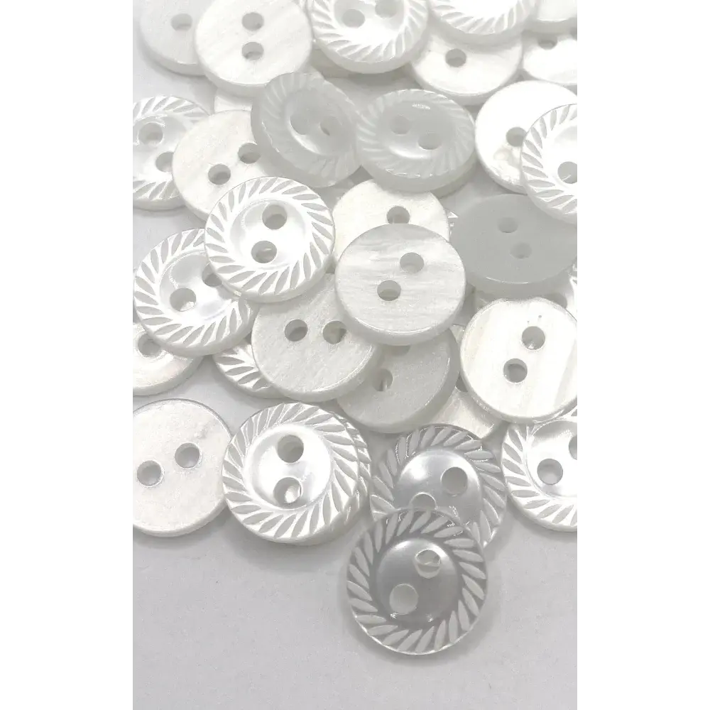 Pile of white two-hole buttons.