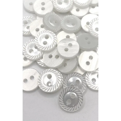 Pile of white two-hole buttons.