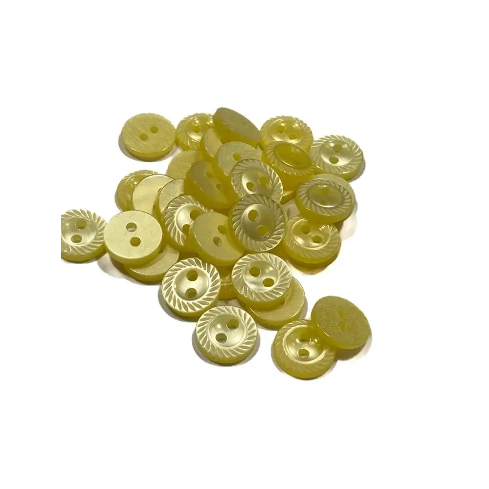 Pile of yellow sewing buttons.