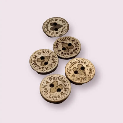 Round wooden buttons with heart-shaped holes.