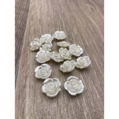 White rose-shaped embellishments.