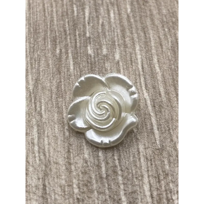 Iridescent white rose embellishment.