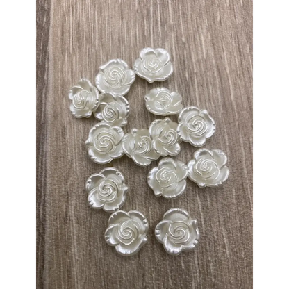 Iridescent white rose embellishments.