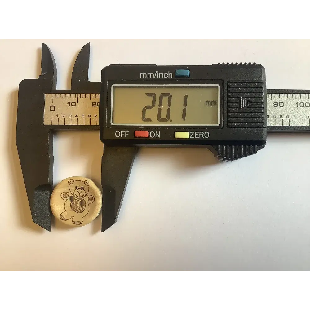 Wooden button with teddy bear design.