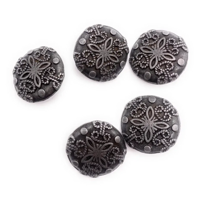 Five decorative, dark-colored buttons.