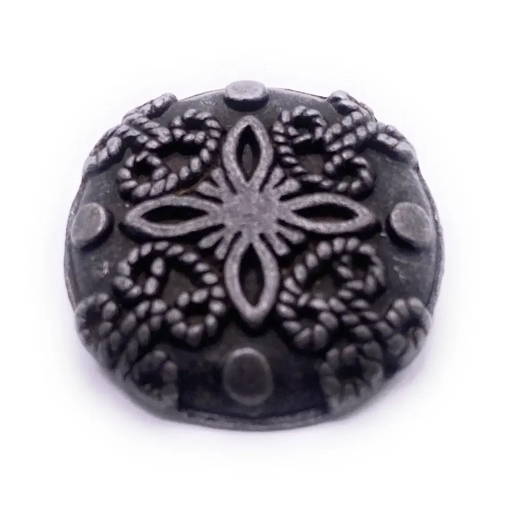 Ornate pewter button.