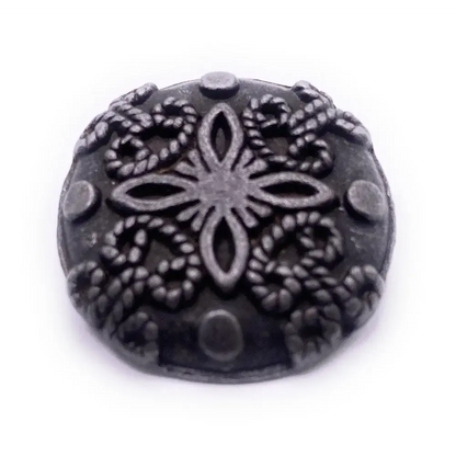 Ornate pewter button.