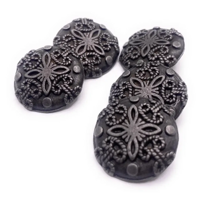 Six decorative, dark metal buttons.