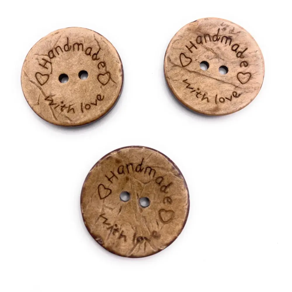 Three brown ’handmade with love’ buttons.