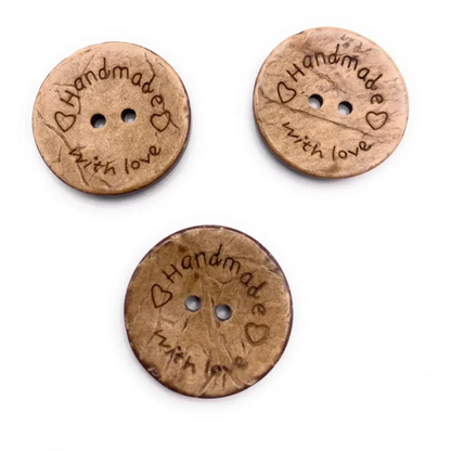 Three brown ’handmade with love’ buttons.