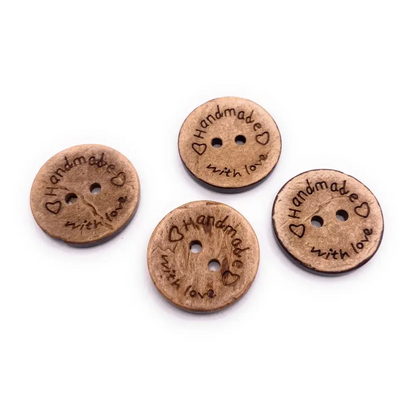 Four wooden ’handmade with love’ buttons.