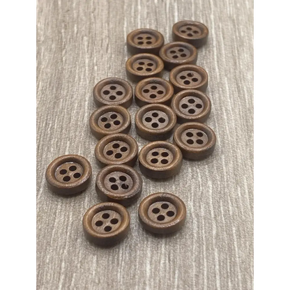 Pile of brown, four-hole buttons.