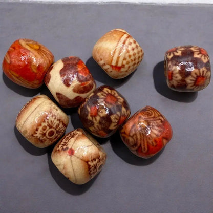 Collection of patterned, cube-shaped beads.