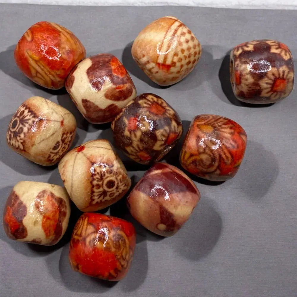 Collection of patterned, rounded cube beads.