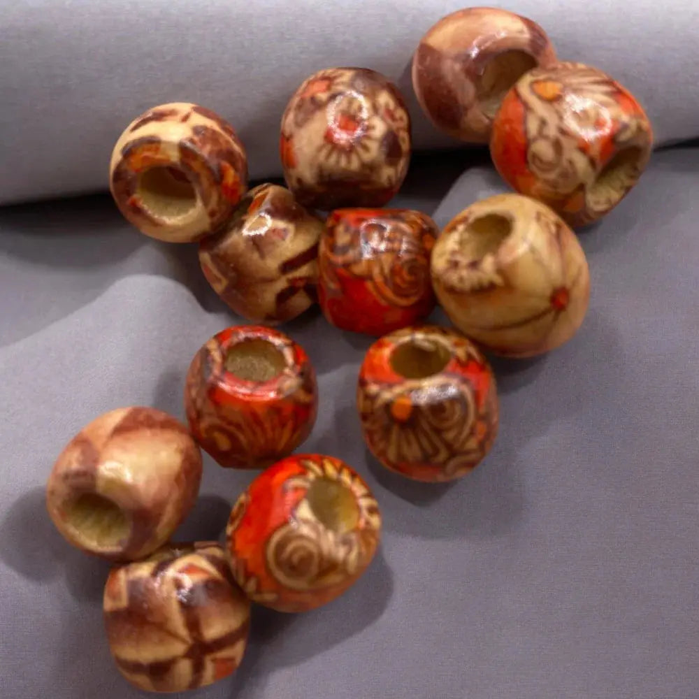 Assorted wooden beads with decorative patterns.