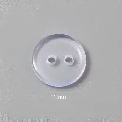 Clear, two-hole button.