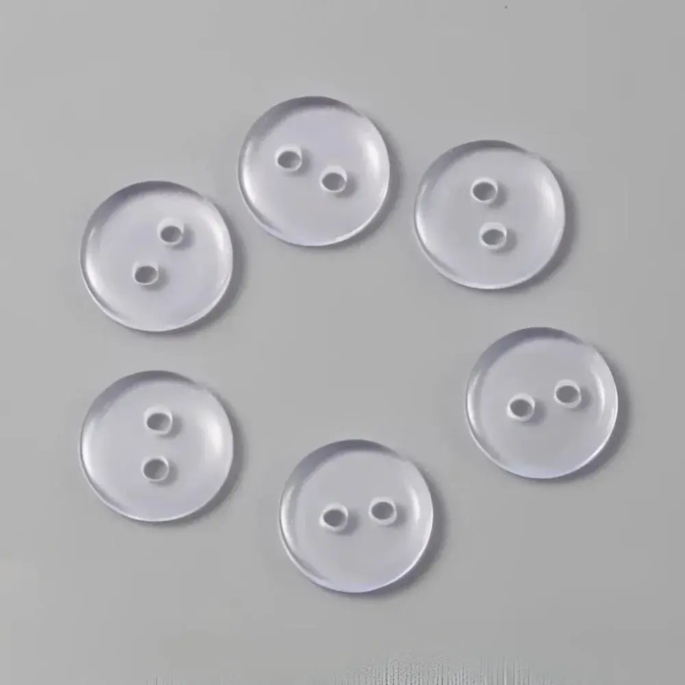 Six clear, two-hole buttons.