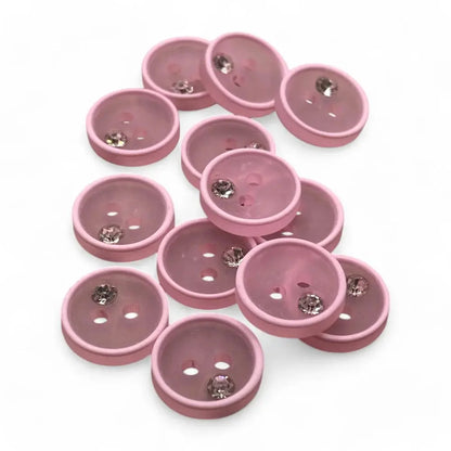 Pink buttons with rhinestones.