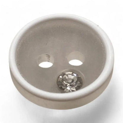 White button with a rhinestone.