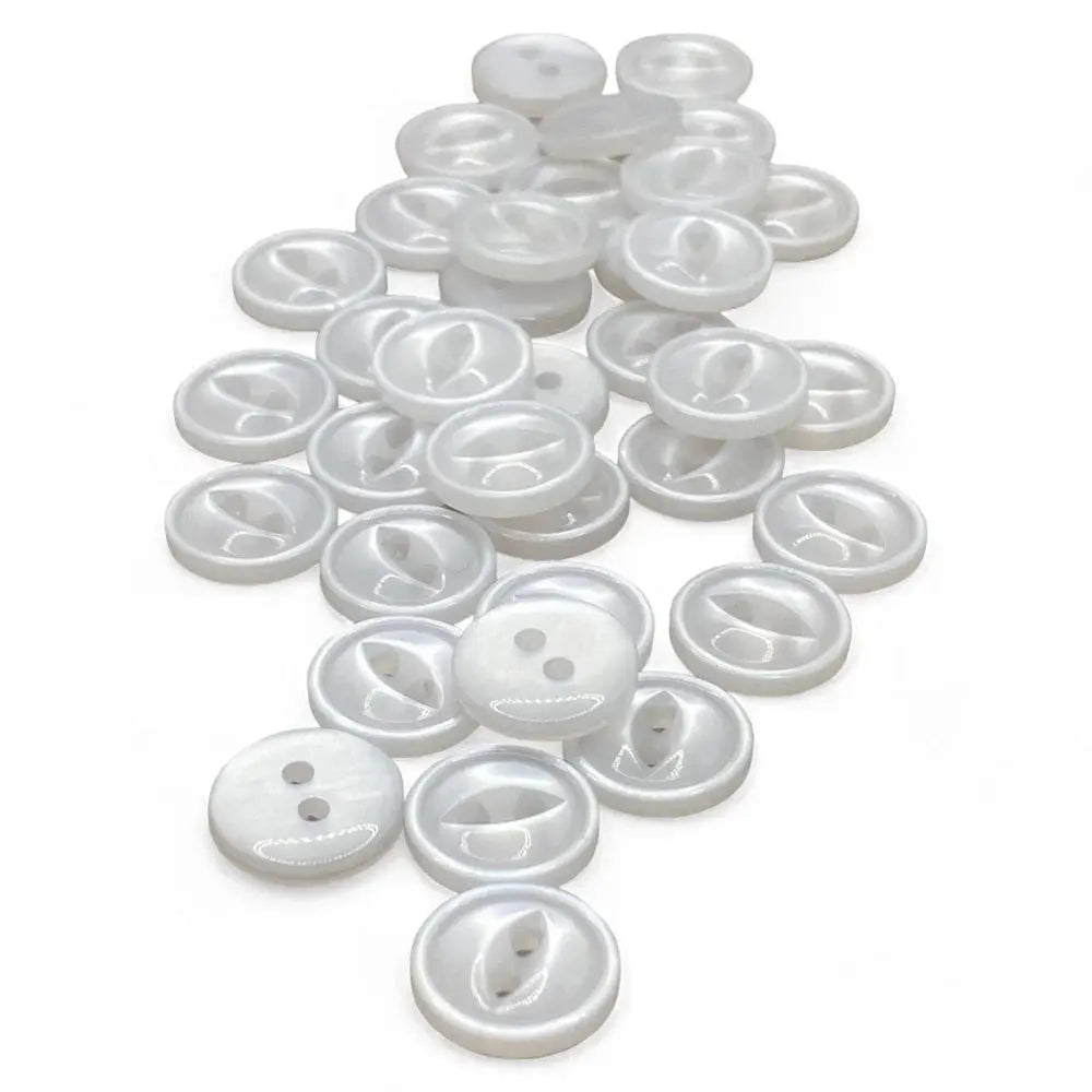Pile of white, two-hole buttons.