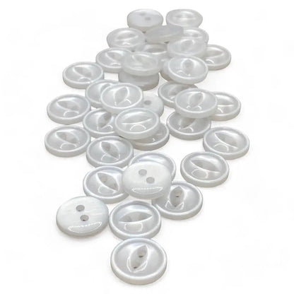 Pile of white, two-hole buttons.