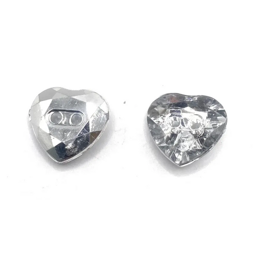 Two heart-shaped, faceted, clear buttons.