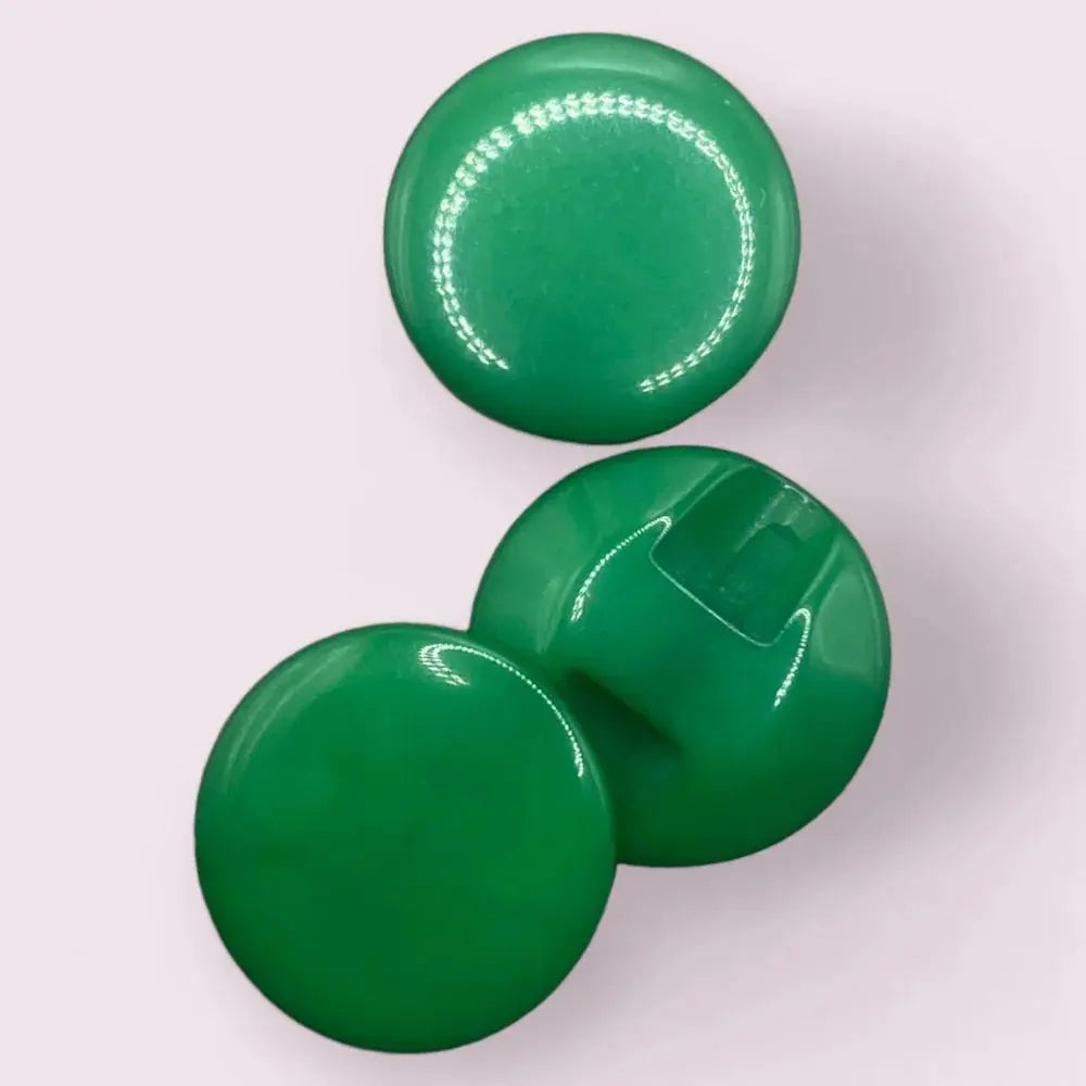 Three glossy green buttons.