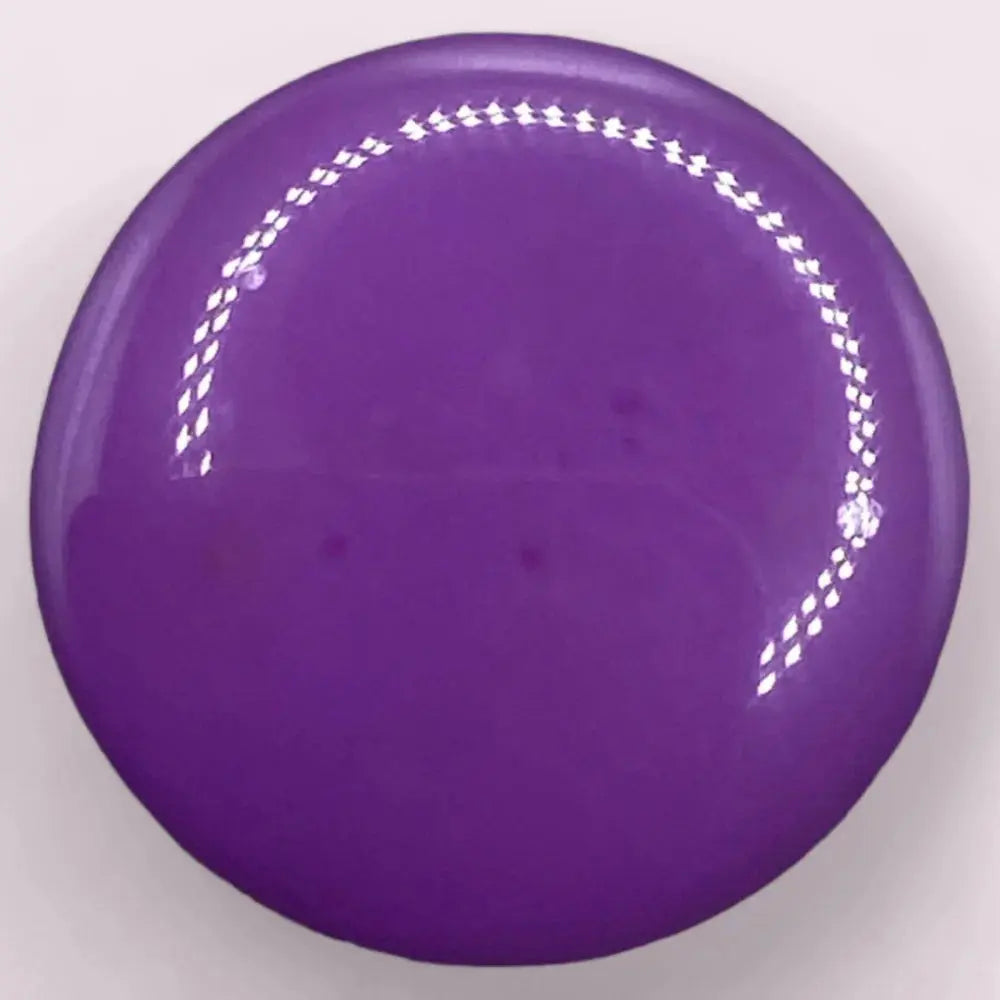 Round, glossy, purple button.