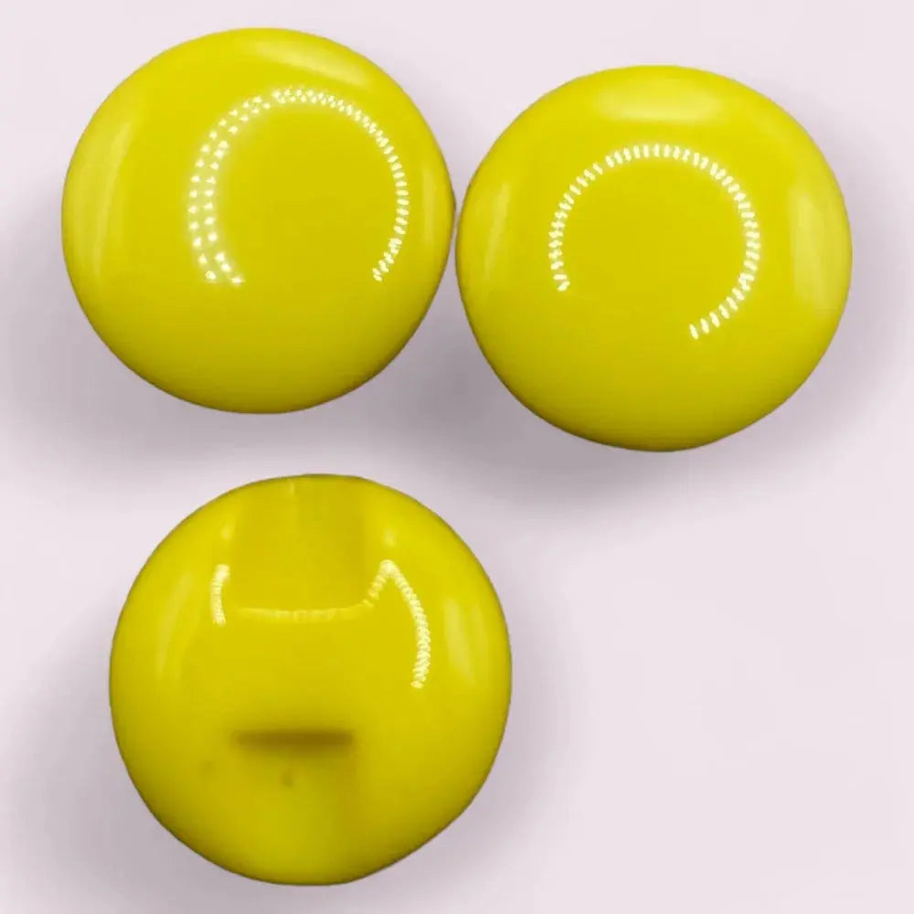 Three shiny yellow buttons.