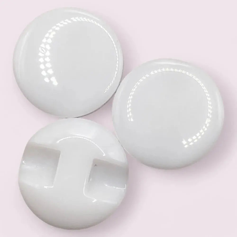 Three white, glossy, round buttons.
