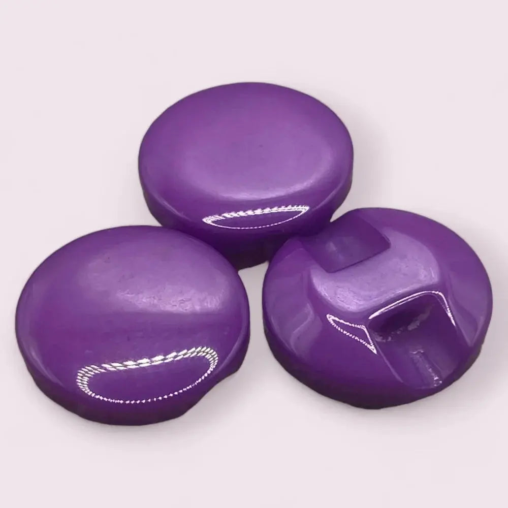 Three glossy purple buttons.
