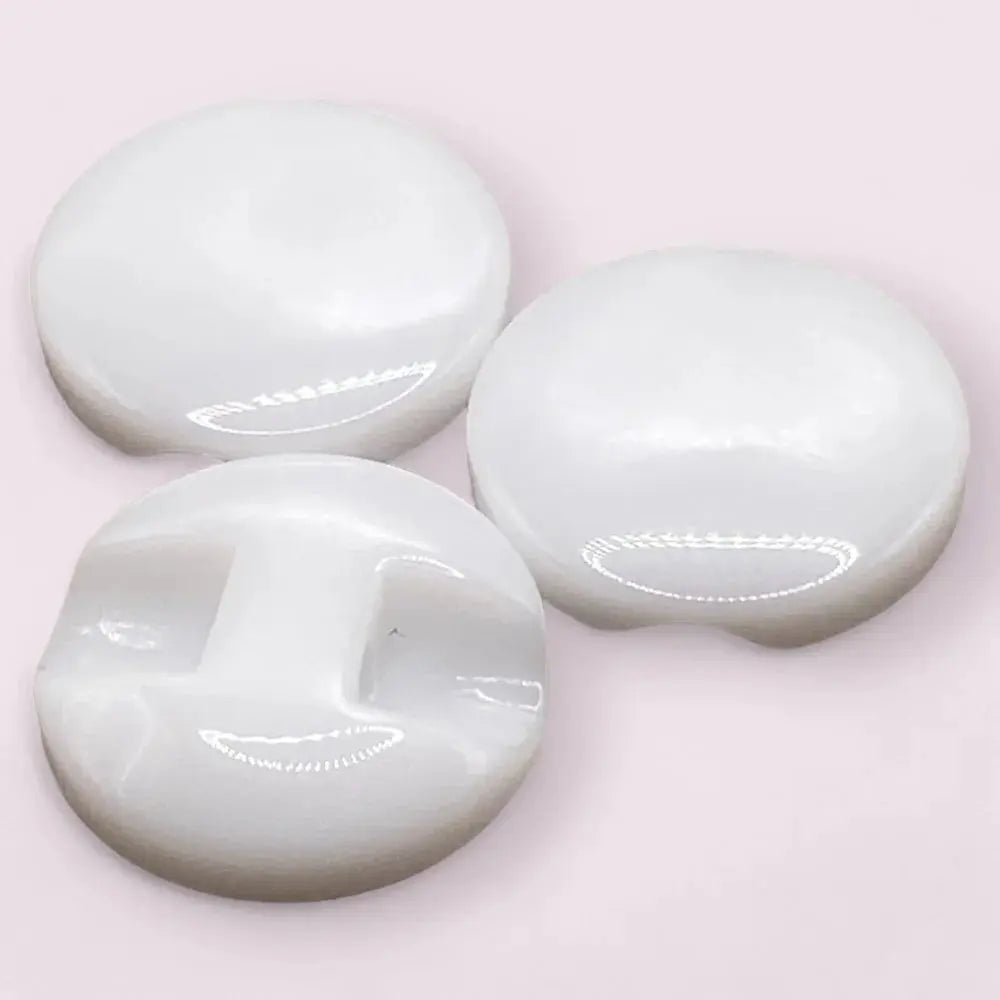 Three white, glossy buttons.