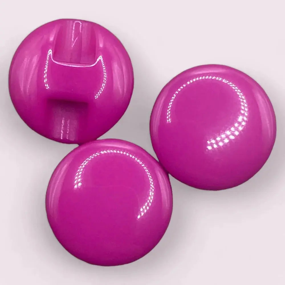 Three shiny magenta buttons.