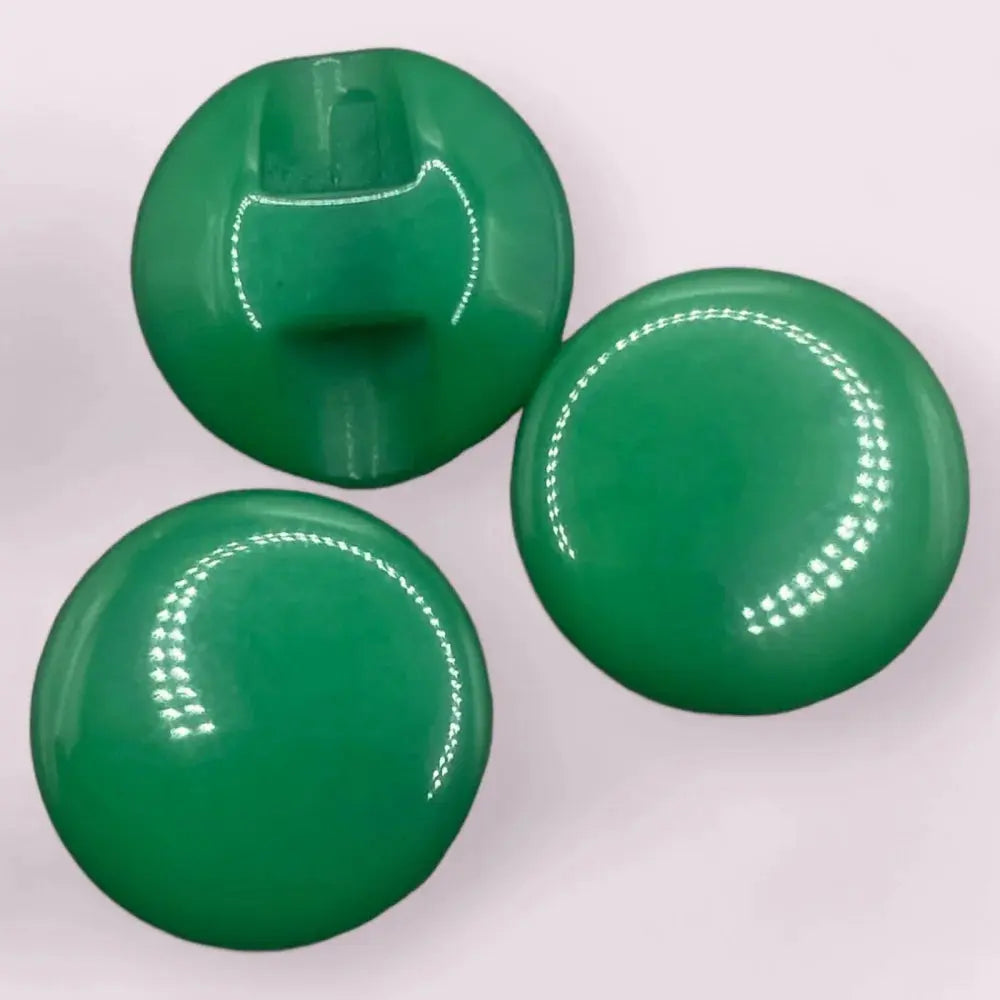 Three shiny green buttons.