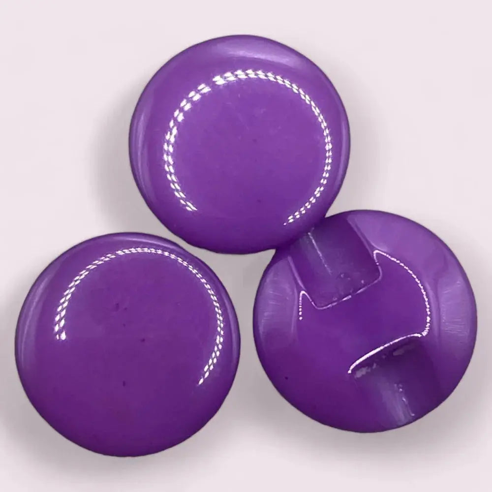 Three glossy purple buttons.