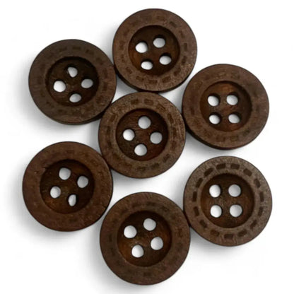 Seven brown, round, four-hole wooden buttons.