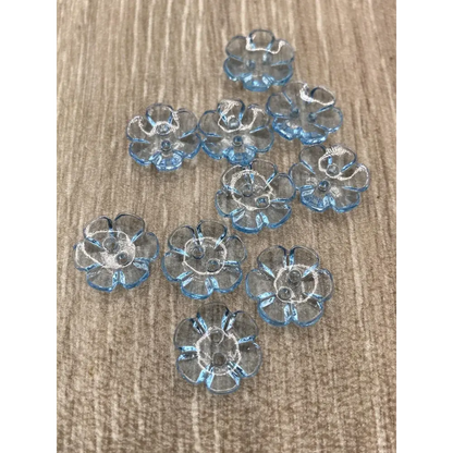 Translucent blue flower-shaped buttons.