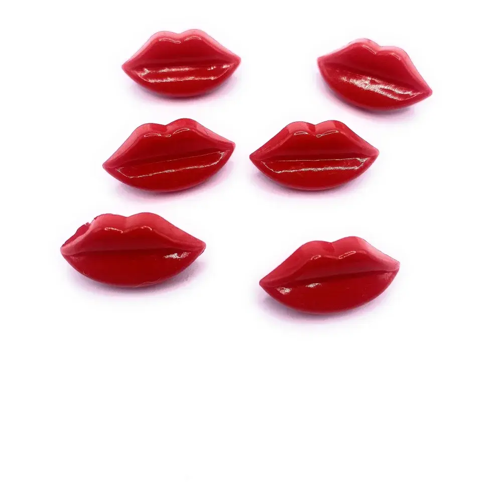 Glossy red lip-shaped decorations.