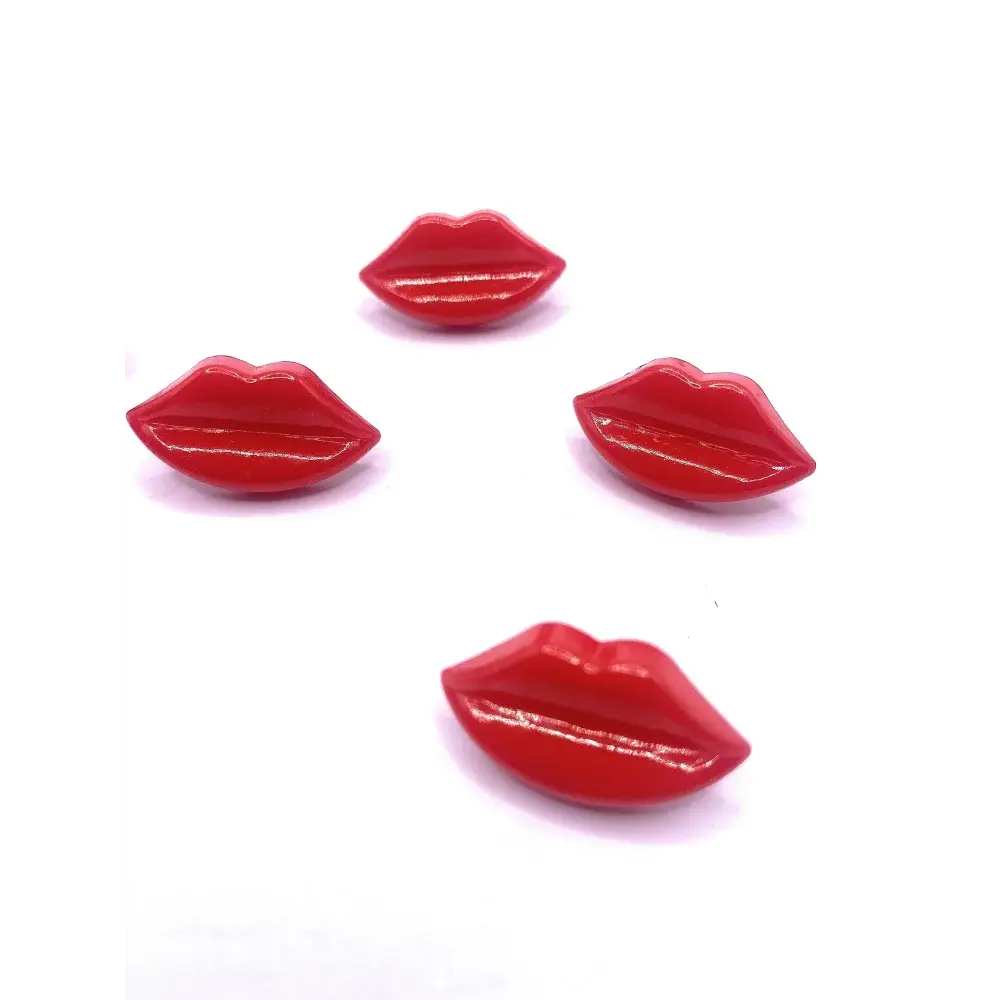 Four glossy red lip-shaped buttons.
