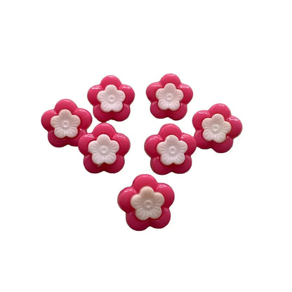 Pink and white flower-shaped buttons.