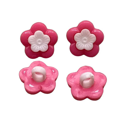 Four pink flower-shaped buttons.