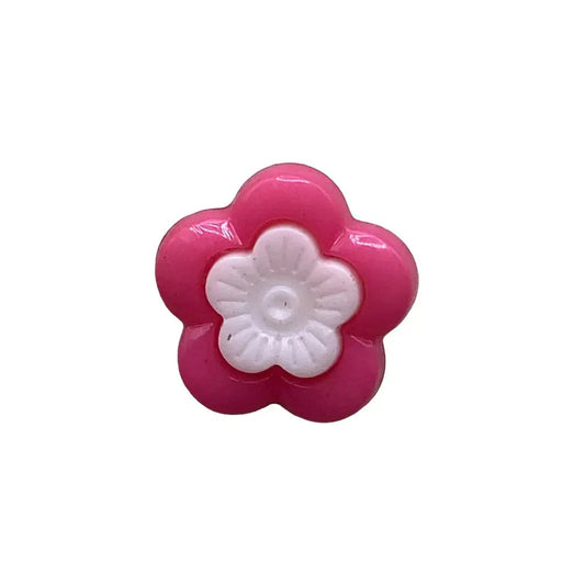 Pink and white plastic flower button.