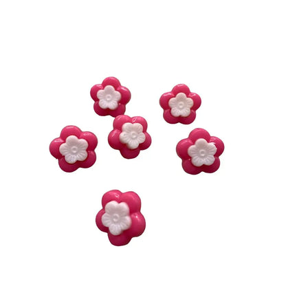 Pink and white flower-shaped buttons.
