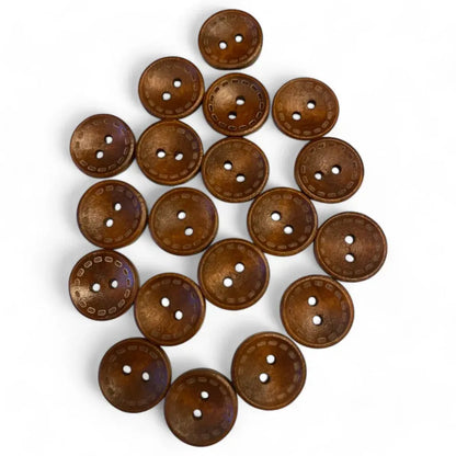 Pile of brown, three-hole buttons.