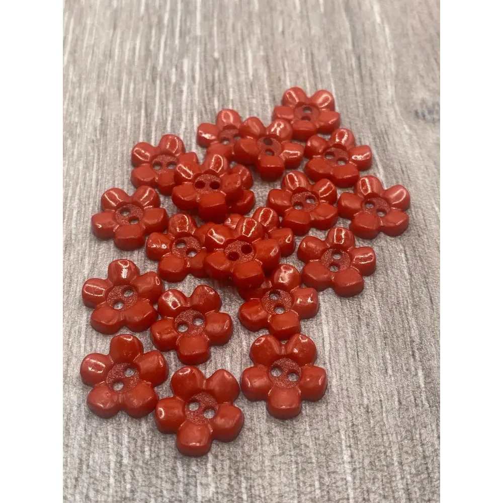 Red flower-shaped buttons.