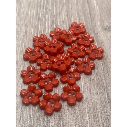 Red flower-shaped buttons.